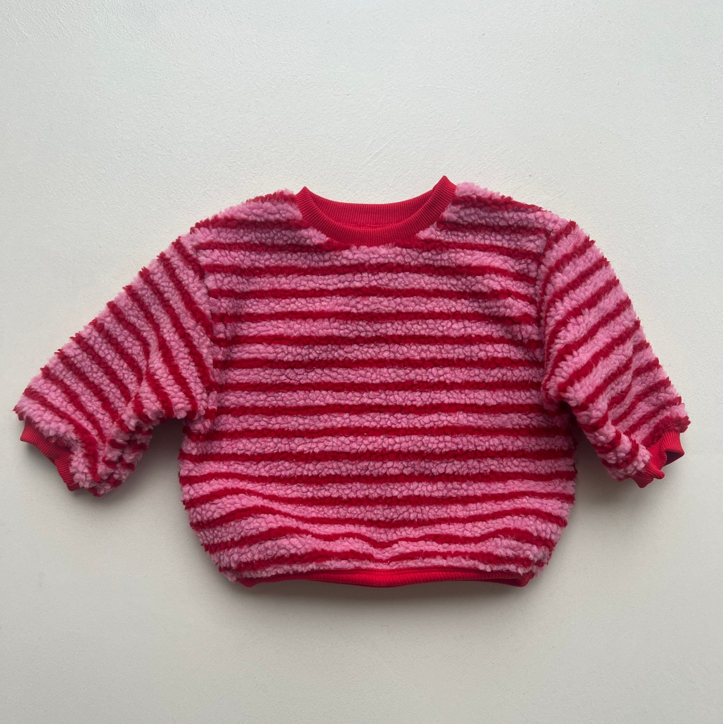Pink striped sweatshirt