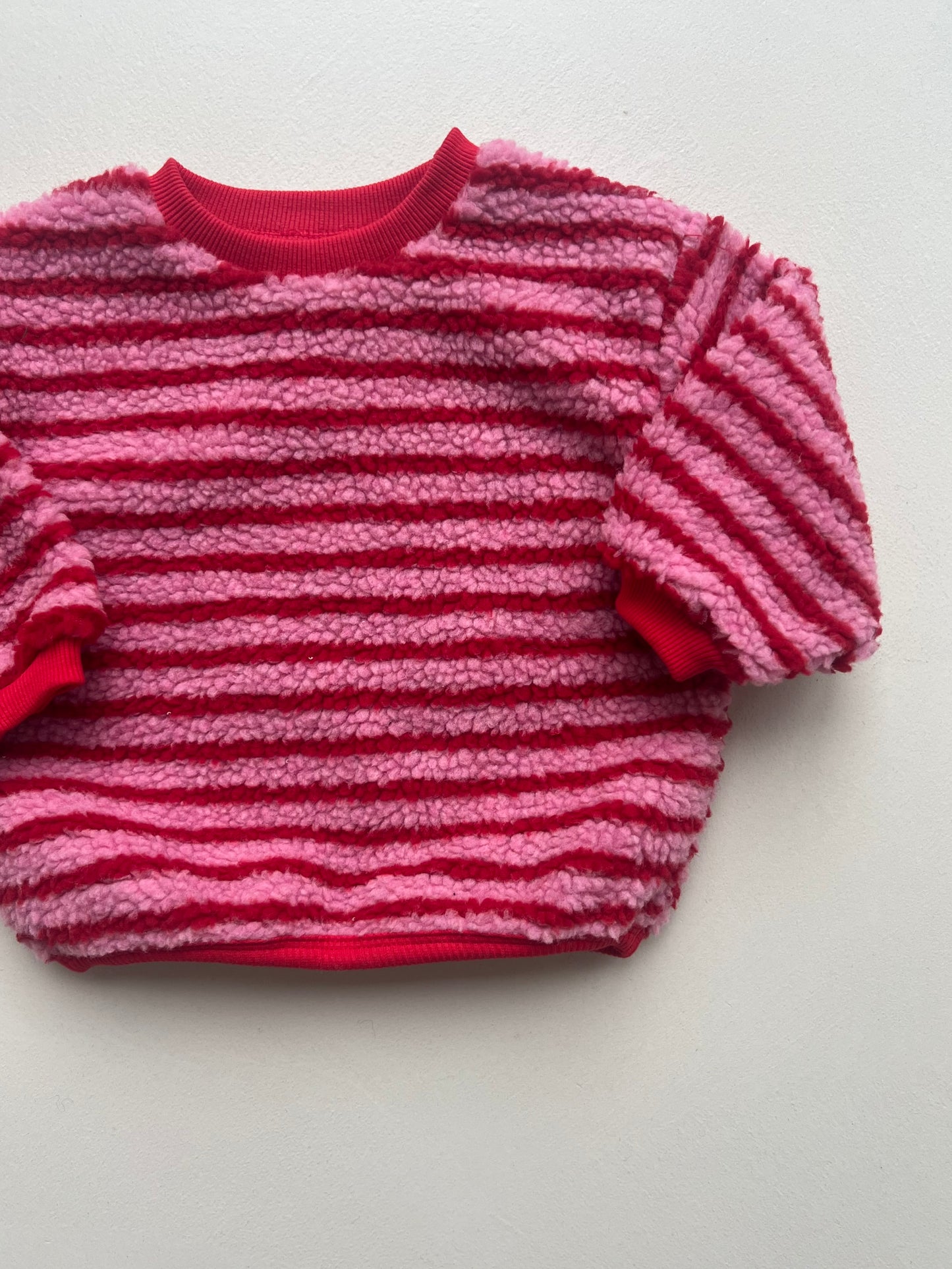 Pink striped sweatshirt