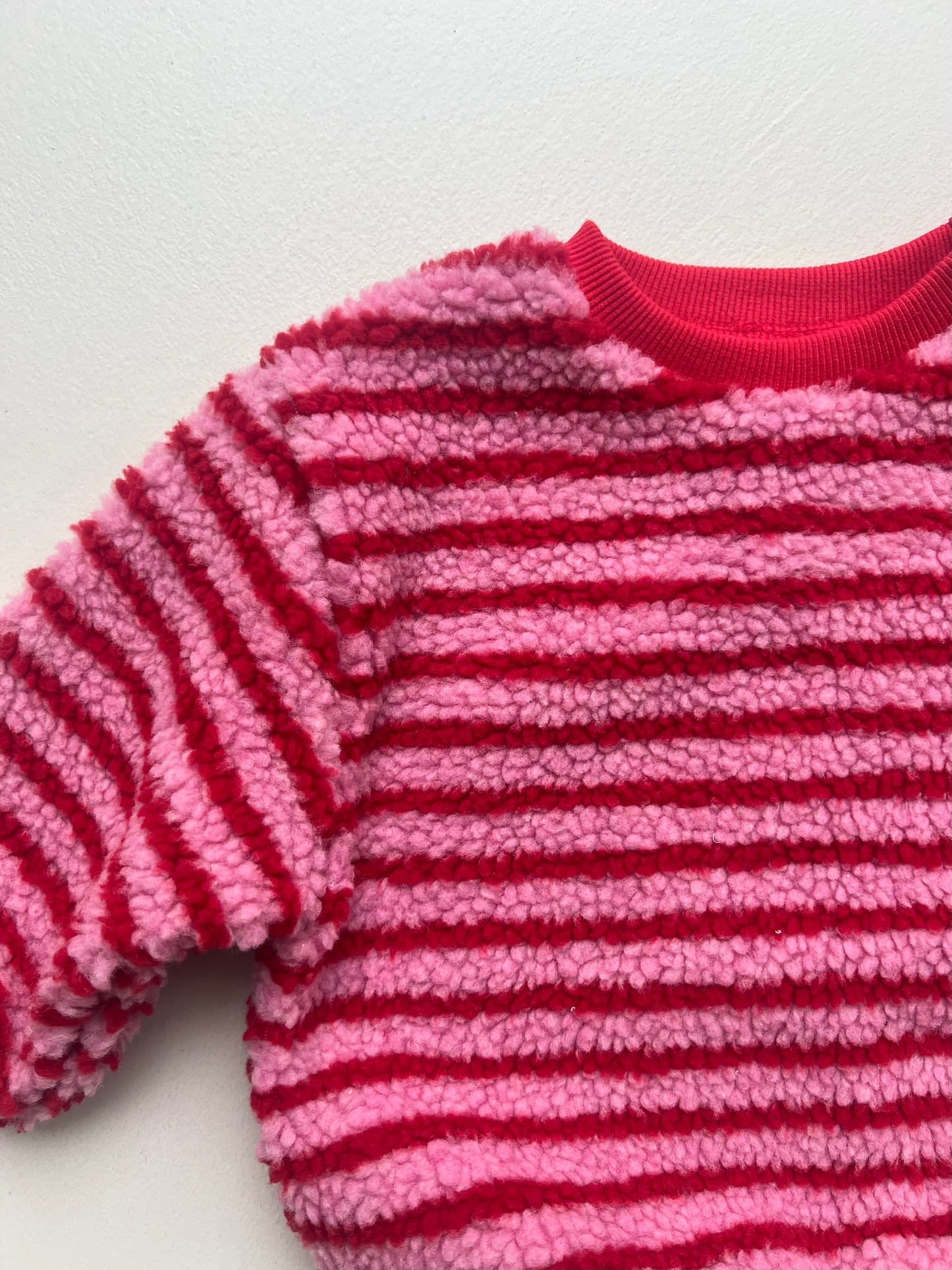 Pink striped sweatshirt