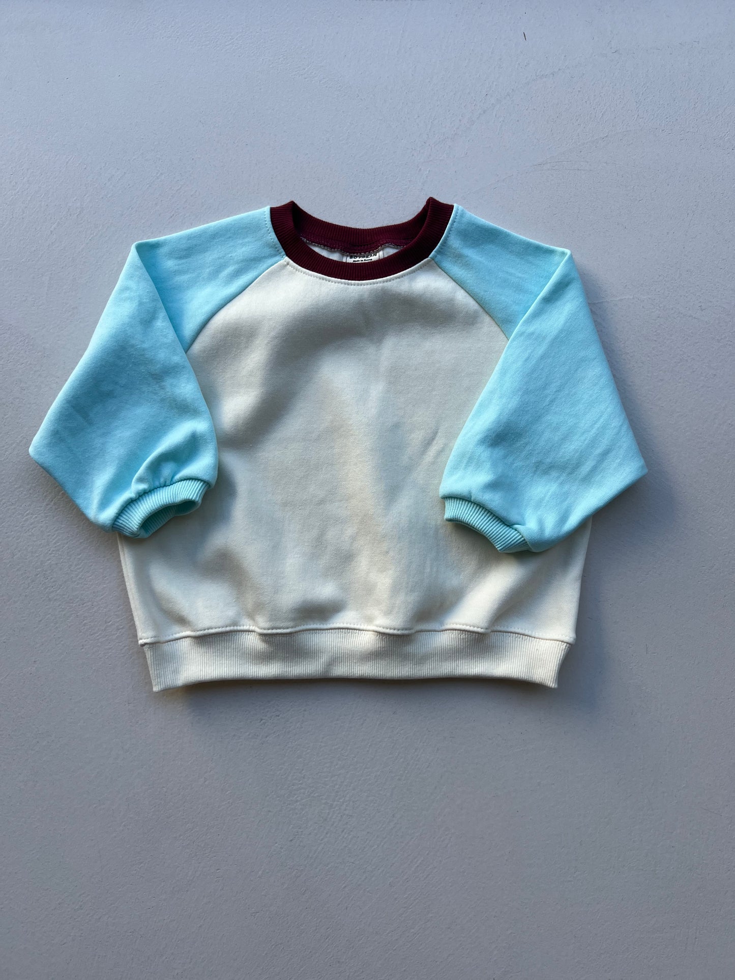 BLUE RAGLAN SWEATSHIRT
